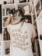 read about a cowboy tee